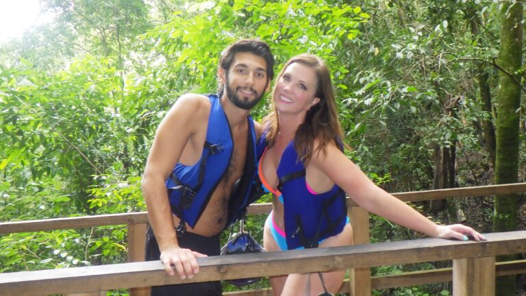 A couple pose on a wooden bridge en route to the hike up to Damajagua Falls in Dominican Republic