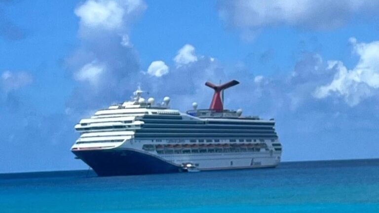 A Carnival cruise ship docks at one of its private islands in the Bahamas.