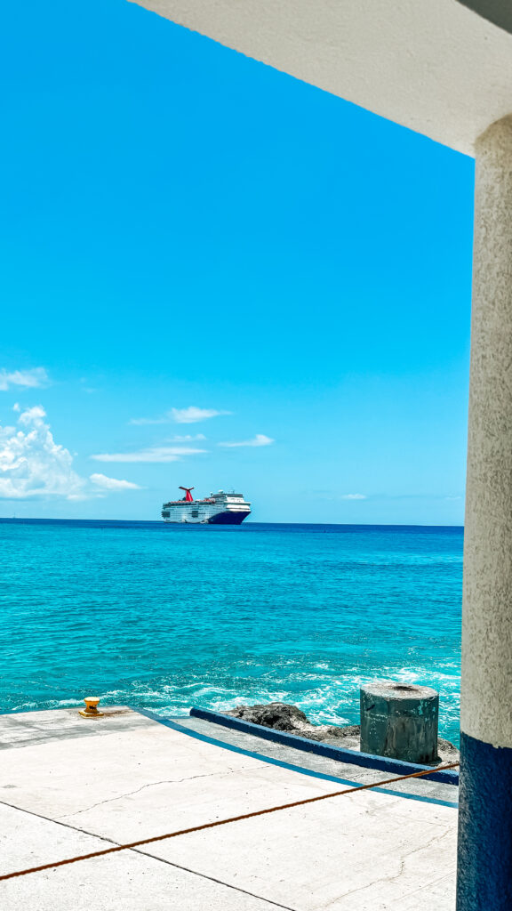 The Carnival Paradise cruise ship seen in the distance from the Grand Cayman cruise terminal. 