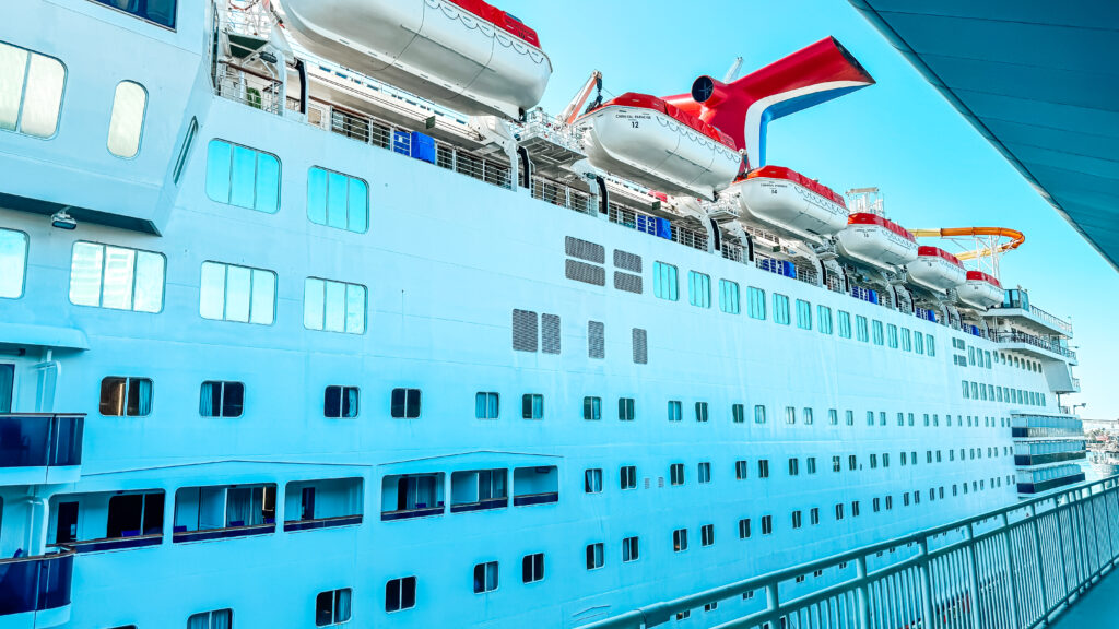 A Carnival cruise ship is seen from a cruise terminal.