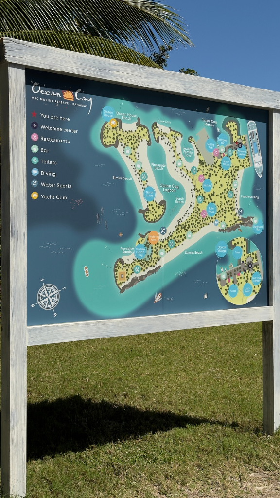 A detailed map of Ocean Cay Marine Reserve in the Bahamas, displayed on a large board.