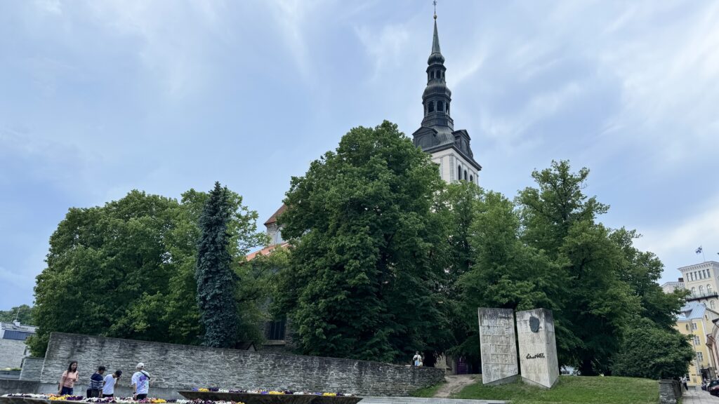 A church steeple towers above Old Town Tallinn in Estonia