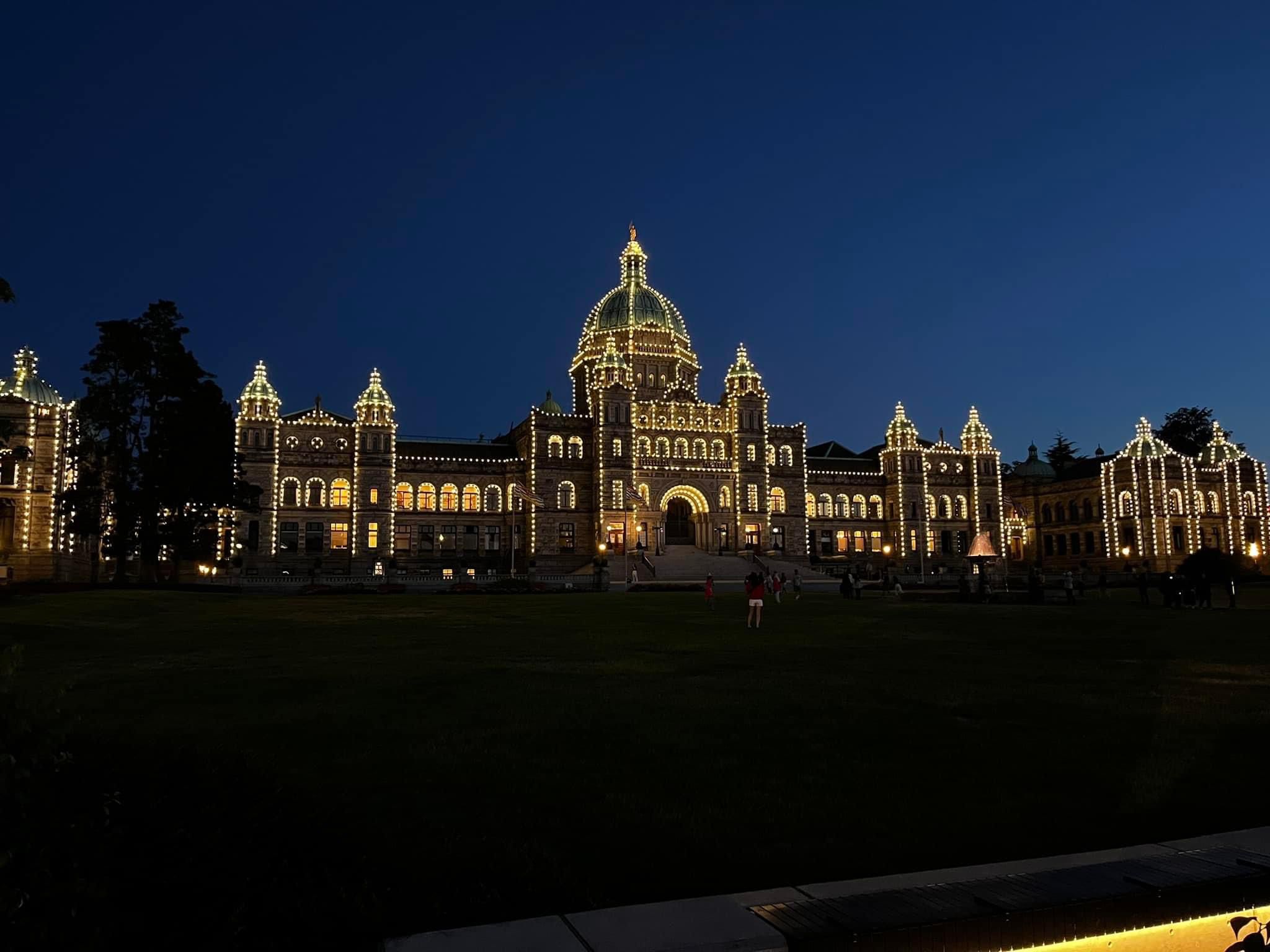 a beautifully illuminated building at night, with a clear dark sky as the backdrop