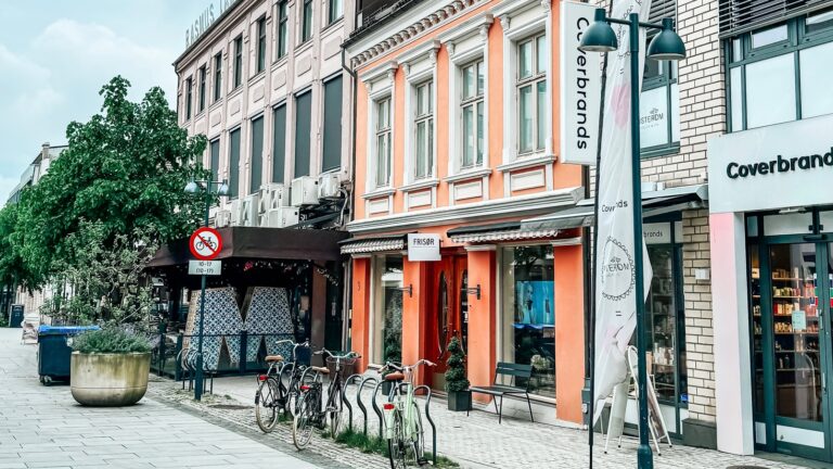 Shops in historic buildings line the streets of Kristiansand in Norway.