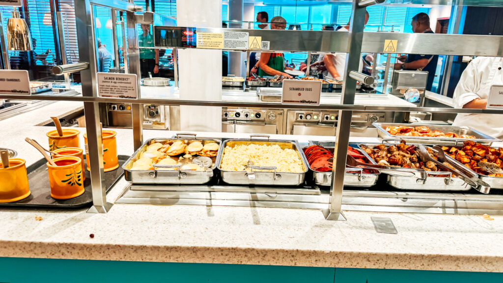 Breakfast buffet on a cruise ship with a variety of hot dishes.