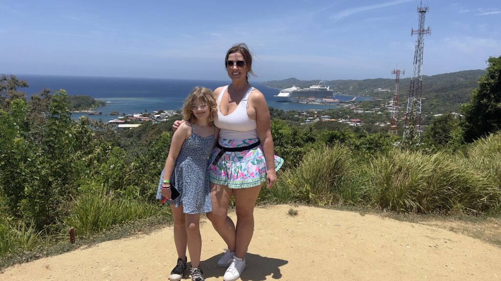 Two woman standing in the hilltop